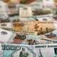 Rouble rises towards 50 vs dollar, first time since May 2015