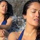 Salma Hayek, 55, wows in blue bikini as waves crash over her on sandy shore in new Instagram post